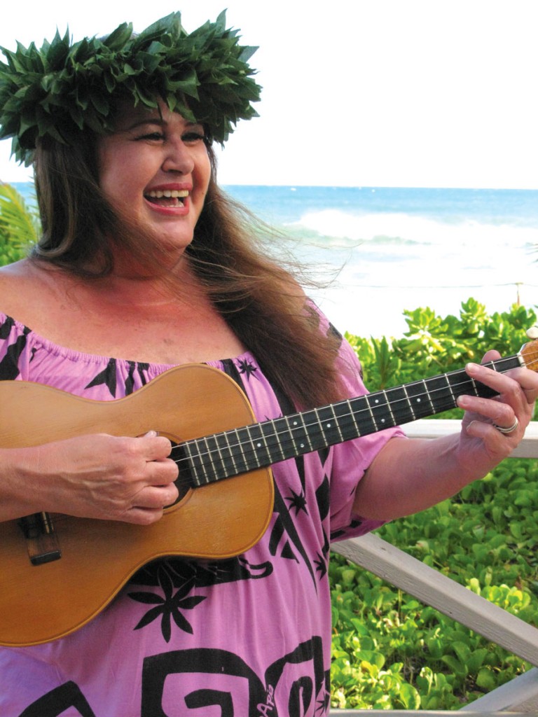 Kaliko Kalima-Salcedo, daughter of Jesse Kalima, plays her father’s 1969 Kamaka on the southwestern shore of Oahu.